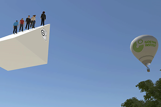 Screenshot einer virtuellen Umgebung: links eine Gruppe Avatare schwebend auf einem Podest, rechts ein Heißluftballon mit dem Logo des Goethe-Instituts